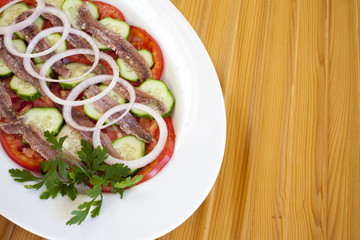 Salted anchovy fillets tasty served with Mediterranean spices and herbs