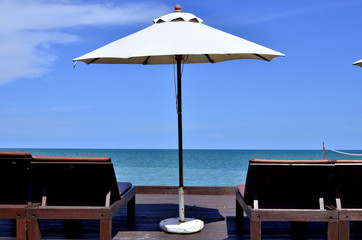 Clear Blue Sky and Sunny on the beach.
Umbrella, Bed, Volleyball Net all activity on the beach with sunny day, clear and blue sky, sea and white sand.