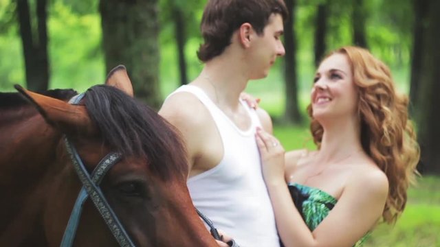 Lovers ride horses in the park, Slow Motion