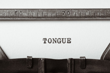 word tongue typed on typewriter