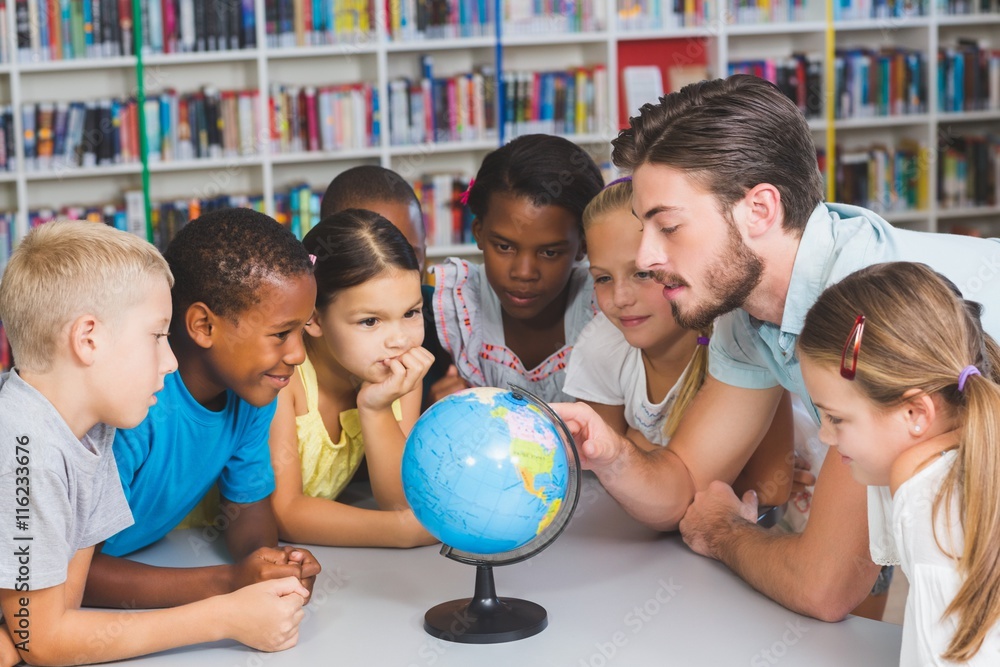 Poster pupils and teacher looking at globe in library