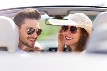 Couple enjoying a drive in a convertible
