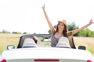 Couple enjoying a drive in a convertible
