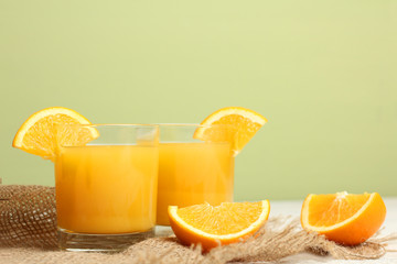 glasses of orange juice on the burlap