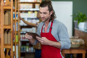 Male staff using a digital tablet