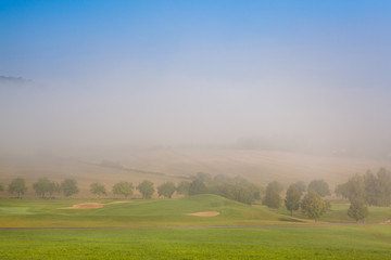 Fototapeta na wymiar Landscape in the spring fog