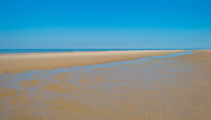 Blue sky over a beach along a sea