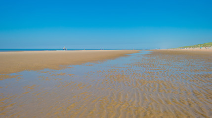 Blue sky over a beach along a sea