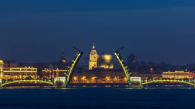 Night view of spit of opened Birzhevoy Bridge timelapse, Saint Petersburg, Russia.