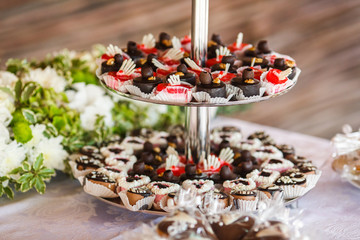 Chocolate sweets served on a layered plates