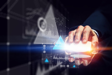 Businessman using wireless mouse . Mixed media