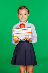 girl in a school uniform with a red apple and books. 