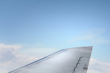 Fototapeta na wymiar Airplane wing out of window . Mixed media