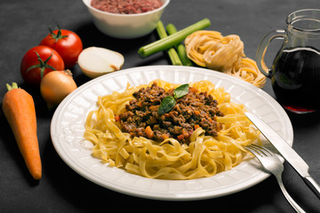 Pasta with bolognese sauce. Ingredients of italian sauce and spa
