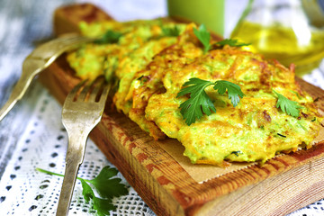 Zucchini fritters with garlic and carrot.
