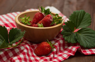 strawberry in a wooden bowl