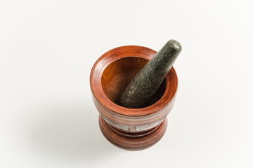 wood mortar and rock pestle isolated on white backgorund