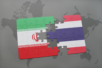 puzzle with the national flag of iran and thailand on a world map background.