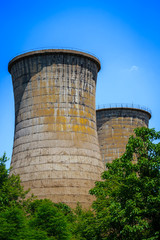 Cooling towers of nuclear power plant in the forest