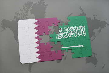puzzle with the national flag of qatar and saudi arabia on a world map background.