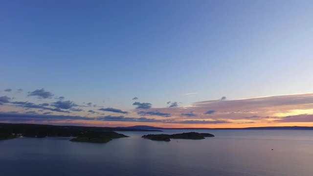 Beautiful sunset, small boats, marina, islands. Perfect evening to enjoy romantic moments.