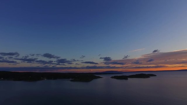 Beautiful sunset, small boats, marina, islands. Perfect evening to enjoy romantic moments.