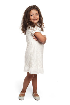 Portrait of a happy little girl on white background looking at the camera smiling