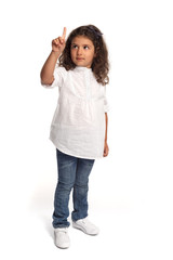 Full length portrait of a happy little girl writing on air on white background