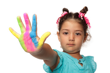 Cute girl showing her colorful hands smiling