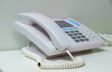 White telephone  on white table