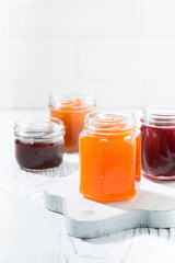 assortment of fruit jams, vertical