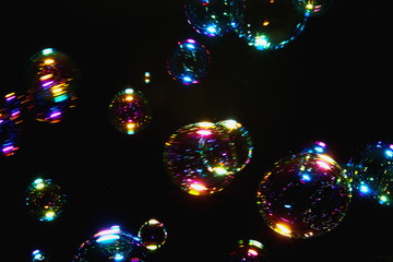 Blurred  soap bubble colorful  with  on dark  backgrounds.