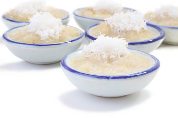 Right front cup steamed banana cake in cup on white floor.