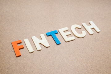FinTech wording on brown background