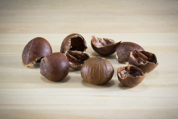Chestnut on the wood background