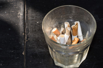 Cigarette in a glass