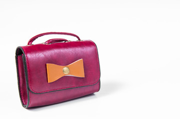 Red leather bag isolated on white background.