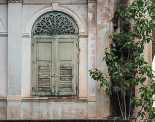 Fototapeta na wymiar Old blue wooden window at ancient building Bangkok, Thailand 