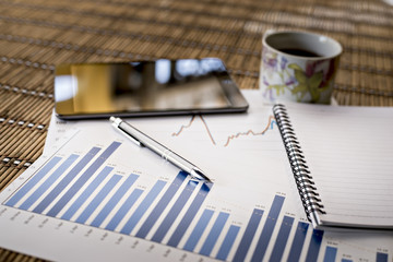 charts of growth on wood background , workplace businessman