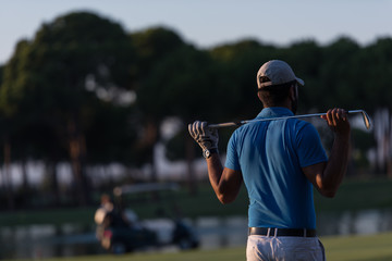 golfer from back at course looking to hole in distance