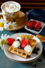 Traditional Belgian waffles with cream whipped cream and fresh b