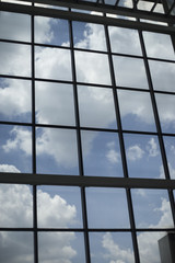 Modern residential window with clouds