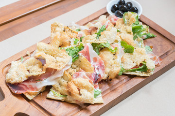 Pizza with parma ham and rockets
