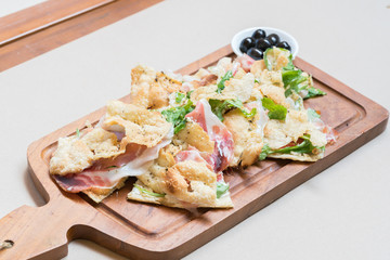 Pizza with parma ham and rockets
