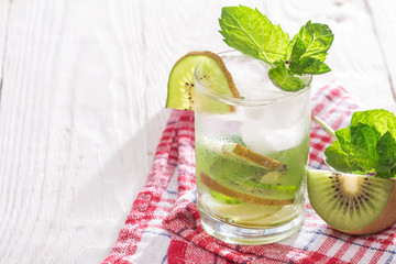 Soft drink with kiwi with ice and mint