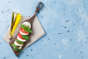 Caprese salad. Mozzarella, tomatoes and basil