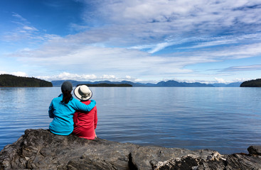 Mother and daughter enjoying nature on the lake