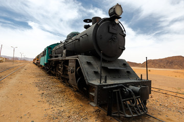 Obraz premium Locomotive train in Wadi Rum desert on sand railroad, Wadi Rum, Jordan.