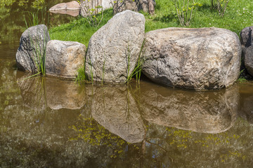 Stones with reflections in water