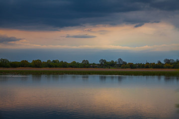 Fototapeta na wymiar Evening sunset over a pond
